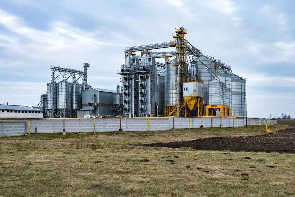 Industrial grain processing plant with silos — environmental noise source
