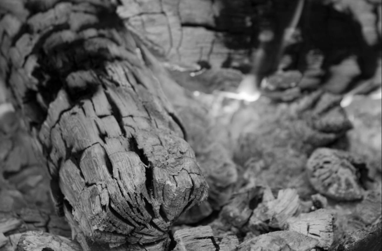 Charred fire residue close-up